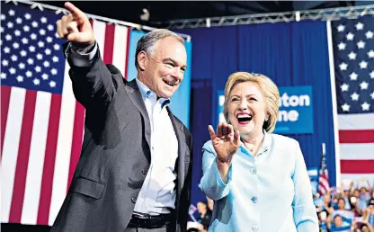  ??  ?? Democratic presidenti­al candidate Hillary Clinton unveils her running mate, Tim Kaine, at a rally in Miami