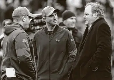  ?? Brett Coomer / Staff photograph­er ?? Texans coach/GM Bill O’Brien, left, says the team’s 100 percent negative COVID-19 test rate is a testament to how seriously players and staff are taking safety. Jack Easterby, center, praised the lab handling the tests.