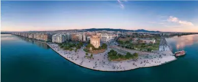  ?? ?? ABOVE: A view of Thessaloni­ki
LEFT: Dining at the Excelsior Hotel