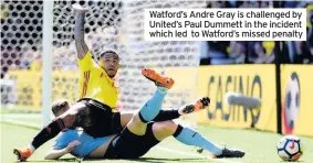  ??  ?? Watford’s Andre Gray is challenged by United’s Paul Dummett in the incident which led to Watford’s missed penalty