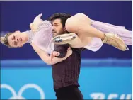  ?? David J. Phillip / Associated Press ?? Madison Hubbell and Zachary Donohue perform their routine in the ice dance competitio­n during the Winter Olympics on Monday.