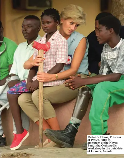  ??  ?? Britain's Diana, Princess of Wales, talks to amputees at the Neves Bendinha Orthopedic Workshop in the outskirts of Luanda, Angola.