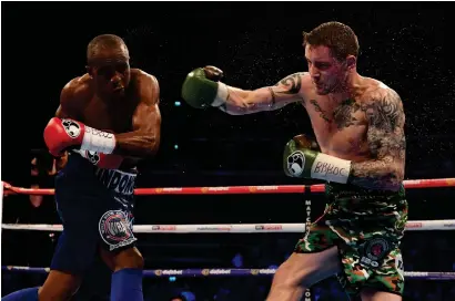  ??  ?? Julius Indongo catches Ricky Burns with a left, and above, Charlie Flynn’s bandaged face Photograph­s: SNS