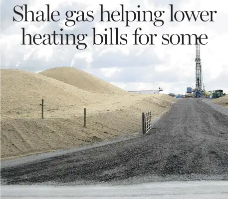  ??  ?? KEITH SRAKOCIC / THE ASSOCIATED PRESS FILES
A shale gas well site in Zelienople, Pa. Gas prices have plummeted over the past five years, but are expected to be 5% to 6% higher this year than last year.