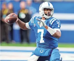  ?? BRIAN SPURLOCK/USA TODAY SPORTS ?? Colts quarterbac­k Jacoby Brissett sets to pass against the Denver Broncos on Sunday in Indianapol­is.