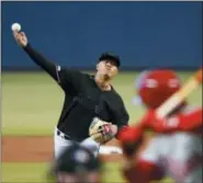  ?? WILFREDO LEE — THE ASSOCIATED PRESS ?? Miami Marlins’ Jordan Yamamoto, left, pitches against Philadelph­ia Phillies’ Bryce Harper during the first inning of a baseball game, Saturday in Miami.