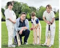  ??  ?? Having a ball with the kids: Phil Robinson plays cricket with the youngsters