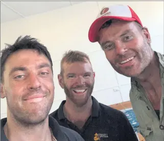  ??  ?? HONOURED AND PRIVILEGED: From left, Harrow-balmoral footballer­s Callum Hobbs, Nick Pekin and president Michael Phelan are all smiles despite being a little worse for wear after helping with bushfire-recovery efforts in Kangaroo Island.