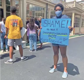  ?? CLAIRE THORTON/USA TODAY ?? UNC alum Carol Shirley protests as the UNC-Chapel Hill board of trustees considers tenure for Nikole Hannah-Jones.