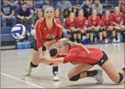  ?? Dan Watson/The Signal ?? (Above) SCCS’ Ashley Rens (4) dives for a save. (Below) Trinity Classical Academy’s Paige Kim (16) put a shot over the net against Santa Clarita Christian School’s Courtney Lotz (10) and Paige Clayton (17).