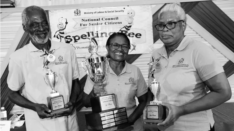  ?? IAN ALLEN ?? Champion speller, Olga Williams (centre) representi­ng the parish of St Mary, poses with second place winner Lenworth Wright of Trelawny and St Andrew representi­tive and third place winner, Marie Purcell.