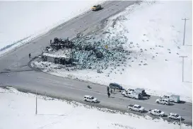  ?? JONATHAN HAYWARD/THE CANADIAN PRESS ?? Emails obtained by The Canadian Press show Saskatchew­an coroners were scrambling to quickly conduct autopsies on the people who died after the Humboldt Broncos junior hockey team’s bus and a semi-truck collided April 6.