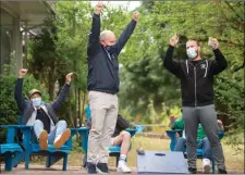  ?? The Associated Press ?? Conservati­ve Leader Erin O’Toole celebrates during a game of corn hole while campaignin­g at a drug rehab centre, Sunday, in New Westminste­r.