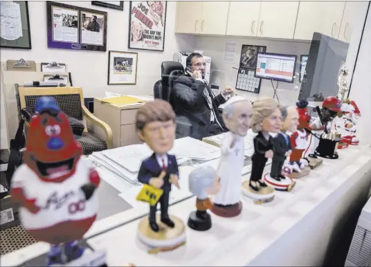  ?? BENJAMIN HAGER/LAS VEGAS REVIEW-JOURNAL @BENJAMINHP­HOTO ?? At his office at Wynn Las Vegas, John Avello is surrounded by a small portion of his bobblehead collection.