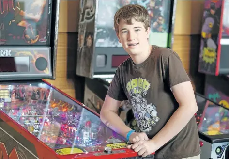  ?? TERESA CRAWFORD/THE ASSOCIATED PRESS ?? Escher Lefkoff poses for a photo at the Pinball Expo 2017, in Chicago, in October. Lefkoff won the Profession­al and Amateur Pinball Associatio­n’s World Championsh­ips last spring. Interest in pinball has skyrockete­d over the last decade or so, with the number of players and competitio­ns growing worldwide, according to the Internatio­nal Flipper Pinball Associatio­n, or IFPA.