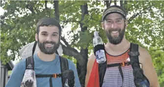  ?? BY STEPHEN BROOKS ?? New England residents Zac Huxley (trail name, “Fruitbaske­t”) and Dan Egan (“Wicket”) at Elkwallow Wayside in Shenandoah National Park. The two began their trek along the 2,200 mile-long Appalachia­n Trail at Springer Mountain in Georgia and expect to reach the end, Mount Katahdin in Maine, in late-August or early-September — after the snow melts and before it sticks again