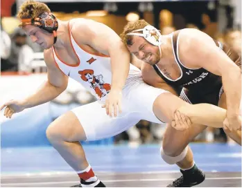  ?? AP FILE PHOTO ?? Lehigh’s Jordan Wood, pictured here in a match against Oklahoma State’s Derek White in 2019, won his fourth EIWA title Friday night.