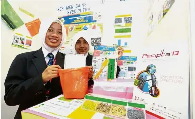  ??  ?? SMK Sains Tunku Syed Putra showing off their inventions at the last PECIPTA conference in KLCC.
