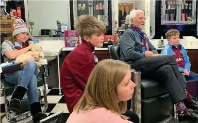  ??  ?? Tony Winder photograph­ed watching the Burnley game with daughter Clare, grandchild­ren, Rafferty, 9, Georgianna, 15, Isabella, 13, and dog Harvey.