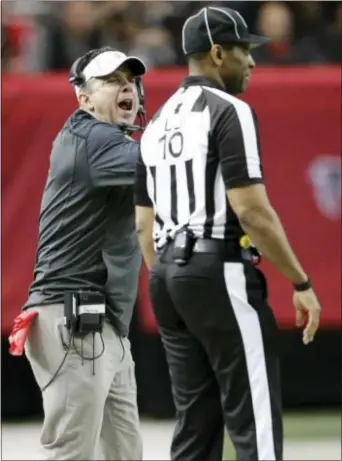  ?? DAVID GOLDMAN — THE ASSOCIATED PRESS ?? New Orleans Saints head coach Sean Payton, never shy to speak his peace, does just to line judge Julian Mapp during the second half in Atlanta Sunday.
that