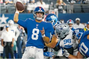  ?? AP PHOTO/MICHAEL AINSWORTH ?? New York Giants quarterbac­k Daniel Jones throws a pass under pressure from Dallas Cowboys defensive tackle Maliek Collins (96) during their game on Sept. 8 in Arlington, Texas. Jones has been named the Giants’ starter.