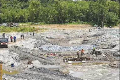  ?? (NWA Democrat-Gazette/Flip Putthoff) ?? Guests tour on Tuesday the main channel of the whitewater run while workers make progress on structures to create rapids and wavers at WOKA Whitewater Park near Watts, Okla. Go to nwaonline.com/210630Dail­y/ to see more photos.