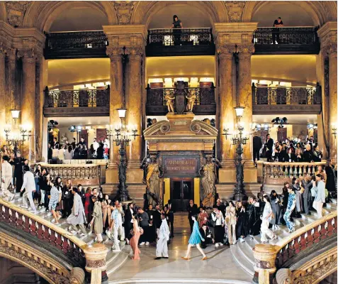  ??  ?? Models walked through the marbled corridors of Paris’s Opera Garnier for Stella Mccartney’s Paris Fashion Week show, showcasing boiler suits, trouser suits and block-toe flats