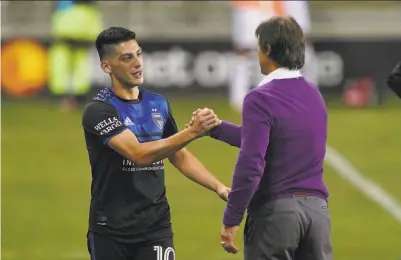  ?? John Todd / ISI Photos / Getty Images ?? Cristian Espinoza ( left) helped the Earthquake­s beat LAFC for the first time after head coach Matías Almeyda ( right) decided San Jose needed to stay the course and just do a better job keeping the ball.