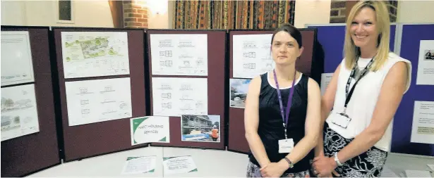  ??  ?? Nicola Harpham and Katy Herrington, from Hart District Council’s strategy and developmen­t team, at an informatio­n event in Eversley Vilage Hall aimed at those interested in the new housing off Westward Ho, in Reading Road, Eversley.