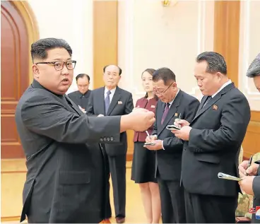  ?? /Reuters ?? Dovish talk: North Korean leader Kim Jong-un meets members of the high-level delegation of the Democratic People’s Republic of Korea that visited South Korea to attend the opening ceremony of the 23rd Winter Olympics in this undated photo released by...