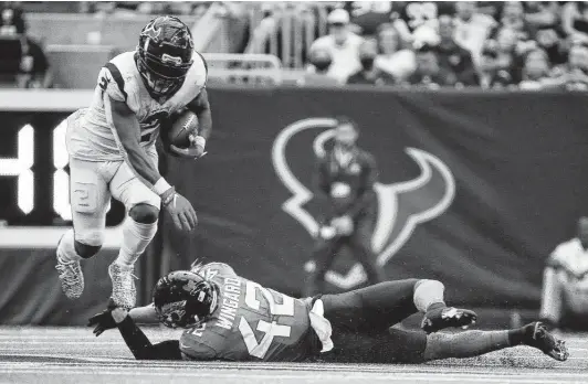  ?? Photos by Yi-Chin Lee / Staff photograph­er ?? The Texans’ Mark Ingram, left, led the team with 85 rushing yards and was one of three running backs who saw action against the Jaguars in Sunday’s opener.