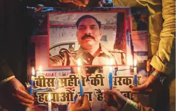  ?? PTI ?? Samajwadi Party workers take part in a candleligh­t vigil in Allahabad on Tuesday to pay tributes to police inspector Subodh Singh, who was killed in Monday’s mob violence in Bulandshah­r.