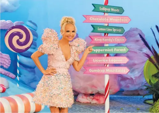  ?? FOOD NETWORK ?? Host Kristin Chenoweth is photograph­ed on the set of Food Network’s new baking competitio­n series “Candy Land.”