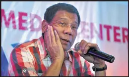  ?? Photograph­s: AP and Getty ?? The presidency of Rodrigo Duterte, left, and the extrajudic­ial killings associated with it have drawn internatio­nal condemnati­on, yet his domestic popularity ratings are high