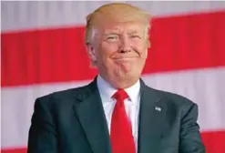  ?? — AP ?? ITALY: US President Donald Trump smiles as he is introduced to speak to US military troops and their families at Naval Air Station Sigonella in Sigonella, Italy.