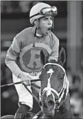  ?? MARK J. TERRILL/AP ?? Irad Ortiz Jr. celebrates after riding Vino Rosso to victory in the Breeders’ Cup Classic horse race on Saturday.