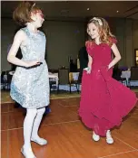  ??  ?? Megan Mueller, left, 8, of Edmond, dances with her friend, MaKenzie Hynd, 8, of Edmond, during the Daddy Daughter Dance.