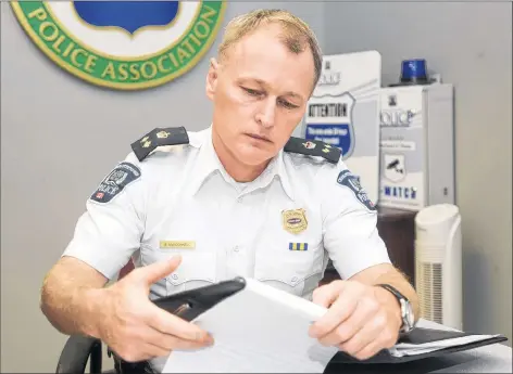  ??  ?? Deputy Police Chief Brad MacConnell makes some notes at the Charlottet­own police station on Monday shortly after the department announced it had charged a 39-year-old city woman with two counts of infanticid­e. The charges, which followed more than a year of investigat­ion, are related to incidents from 2014 and 2016.