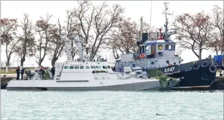  ?? AFP ?? Seized Ukrainian military vessels sit anchored in a port in Crimea.