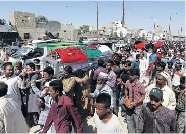  ?? EPA ?? Supporters of the Mutahida Qaumi Movement (MQM) and relatives attend the funeral of MQM workers who were killed by rangers during an operation, in Karachi, Pakistan, on Saturday. MQM claims the workers were not involved in criminal activities.