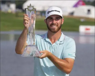  ?? ANDY CLAYTON-KING - THE ASSOCIATED PRESS ?? Matthew Wolff holds the trophy after winning the 3M Open golf tournament Sunday, July 7, 2019, in Blaine, Minn.