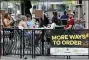  ?? GENE J. PUSKAR - THE AP ?? People gather at tables outside Bar Louie in Pittsburgh on Sunday, June 28. In response to the recent spike in COVID-19 cases in Allegheny County, health officials are ordering all bars and restaurant­s in the county to stop the sale of alcohol for on-site consumptio­n beginning Tuesday afternoon.