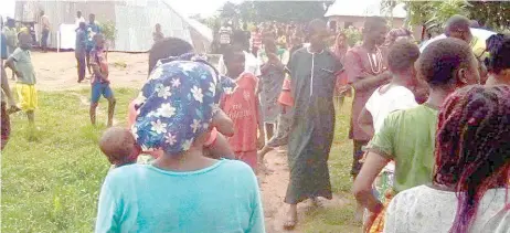  ?? PHOTO: Charles Akpeji ?? Sympathise­rs at the scene of Holy Ghost Church building collapse in Abeda Pave Community, Takum Local Council, Taraba State, where two persons died, many got injured… yesterday