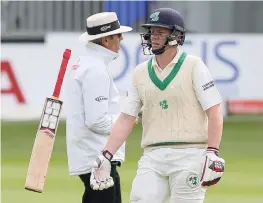  ?? AFP ?? Ireland’s Kevin O’Brien walks back to the pavilion after being dismissed for 118 on the final day of their inaugural Test against Pakistan at Malahide Cricket Club in Dublin on Tuesday. —