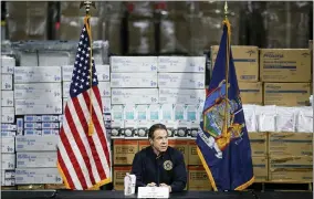  ?? JOHN MINCHILLO — THE ASSOCIATED PRESS FILE ?? On March 24, 2020, New York Gov. Andrew Cuomo speaks during a news conference against a backdrop of medical supplies at the Jacob Javits Center that will house a temporary hospital in response to the COVID-19outbreak in New York.