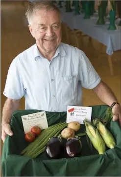  ??  ?? John Warren with his best in class collection of vegetables.