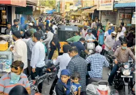  ?? — P. SURENDRA ?? People crowd a narrow lane for shopping in Nampally in Hyderabad on Sunday, a day ahead of Id-ul-Fitr. Deccan Chornicle wishes its readers Id Mubarak.