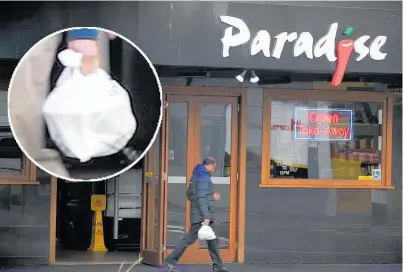  ?? Photo / Michael Craig ?? Paradise restaurant is continuing to supply customers with single-use plastic bags after the ban.