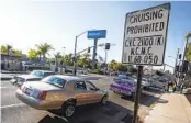  ?? ALEJANDRO TAMAYO U-T FILE ?? The San Diego Lowrider Associatio­n held a cruise in National City in 2019 past a sign banning the cruises.