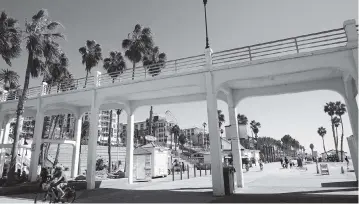  ?? PHOTOS BY GREGORY BULL AP ?? The iconic bridge connecting the Oceanside pier in Oceanside, Calif., is deteriorat­ing because the city lacks the money for a roughly $25 million rehabilita­tion. Some cities have used money from the American Rescue Plan, meant for COVID-19 relief, to pay to repair and upgrade local projects.